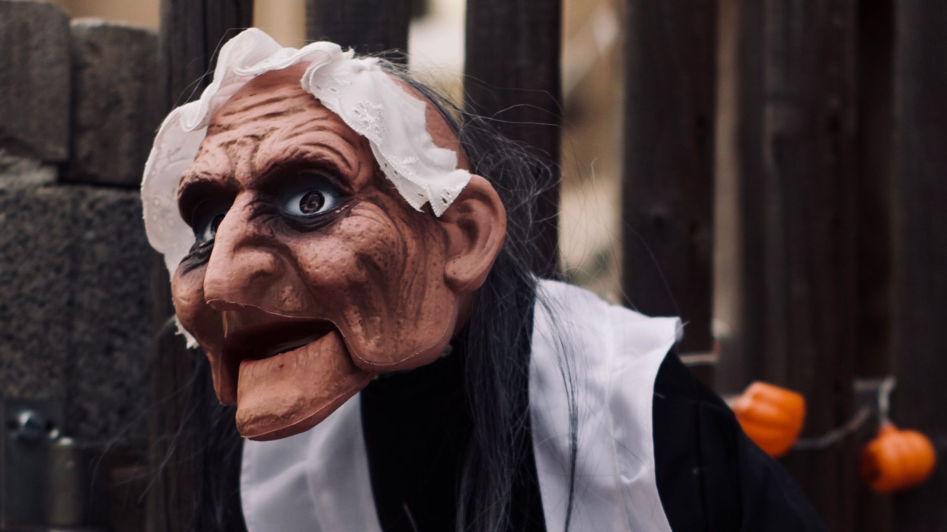 Creepy Halloween witch decoration with tray of candy, set in Zwickau, Germany.