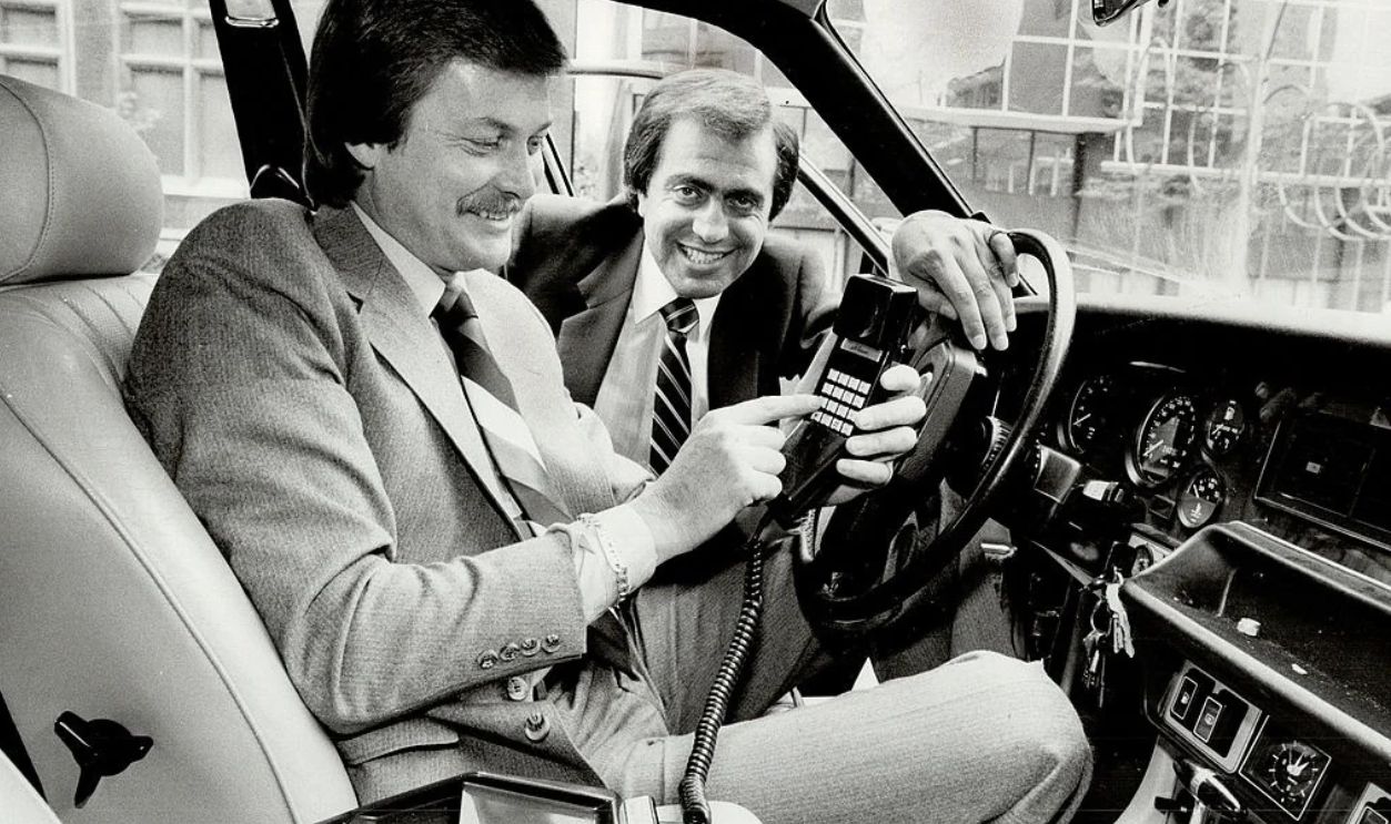 Portable chatter: Allan Nilsson; left; and Sheldon Kideckel of AMTS demonstrate their in-car phone.