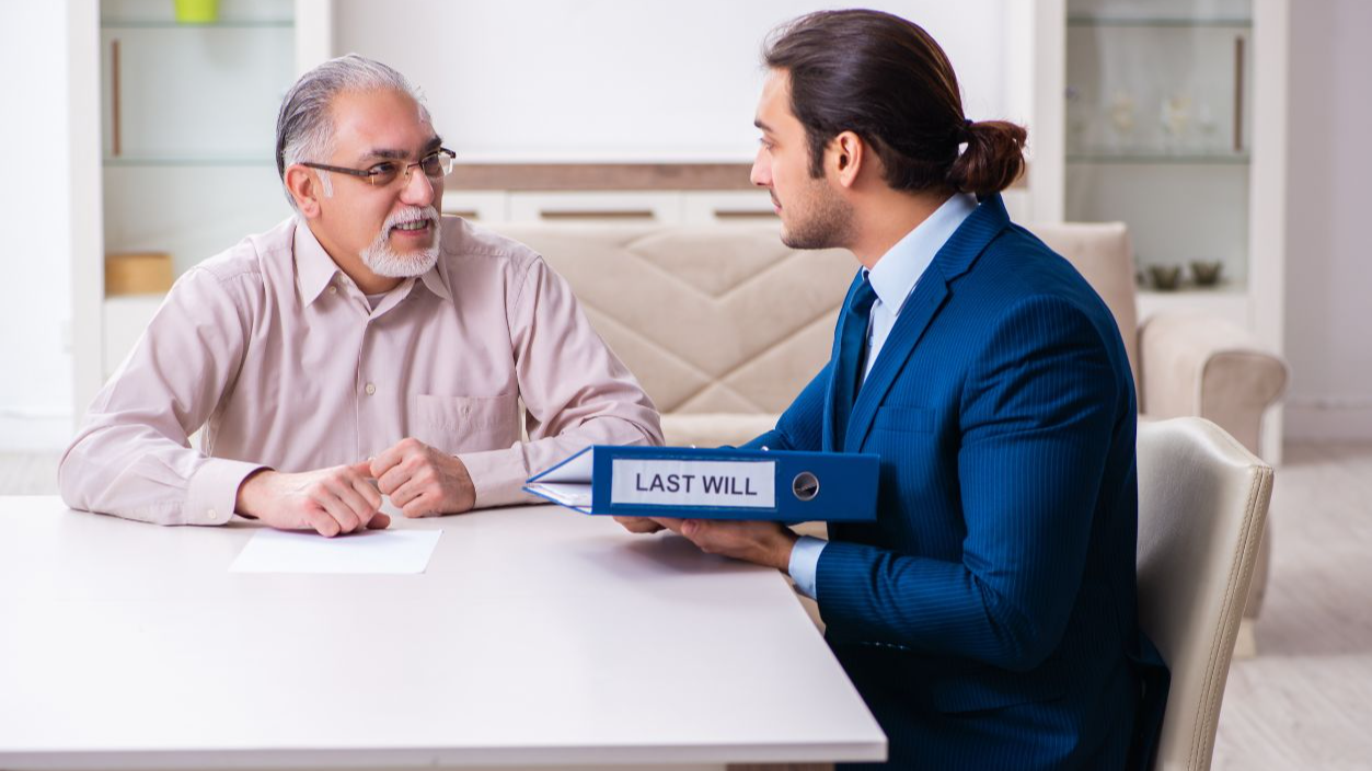 Shutterstock-1884193732, Young male lawyer visiting old man in testament concept