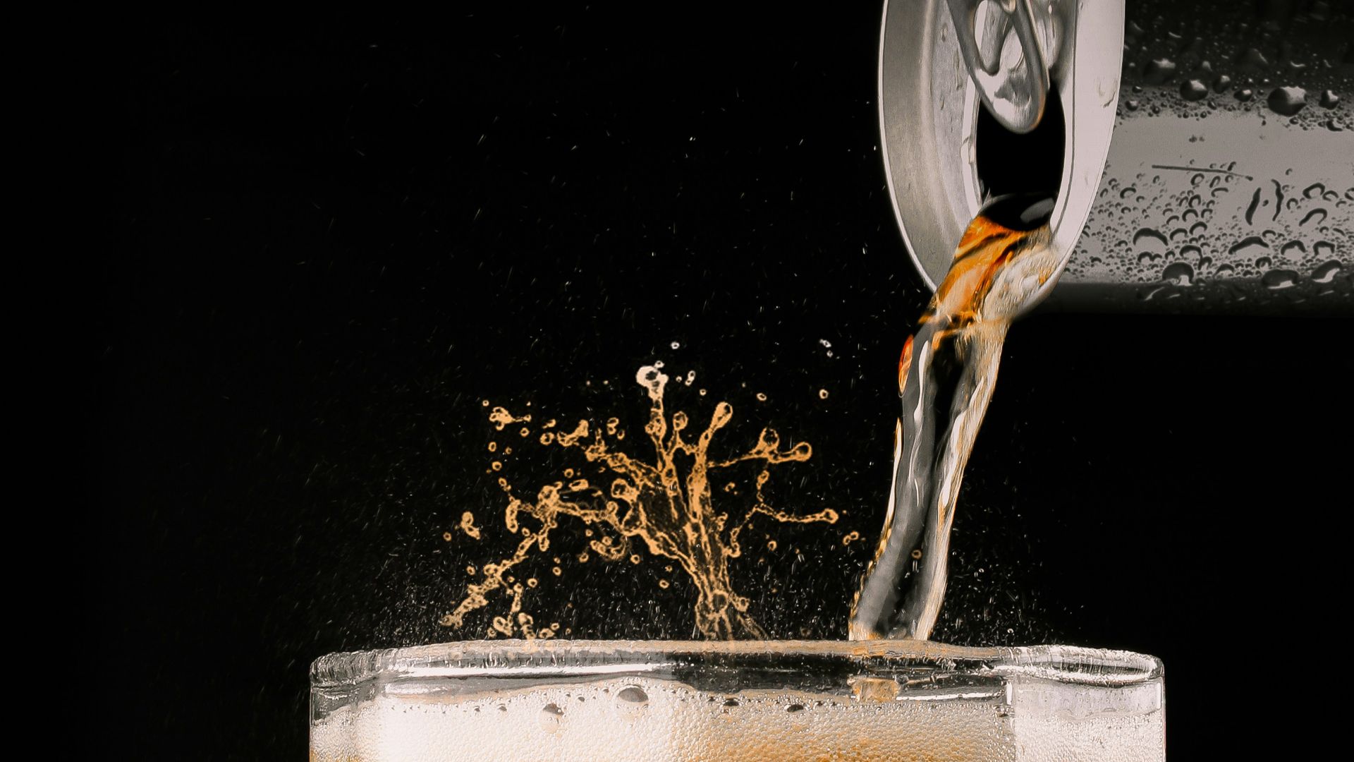 clear drinking glass with brown liquid