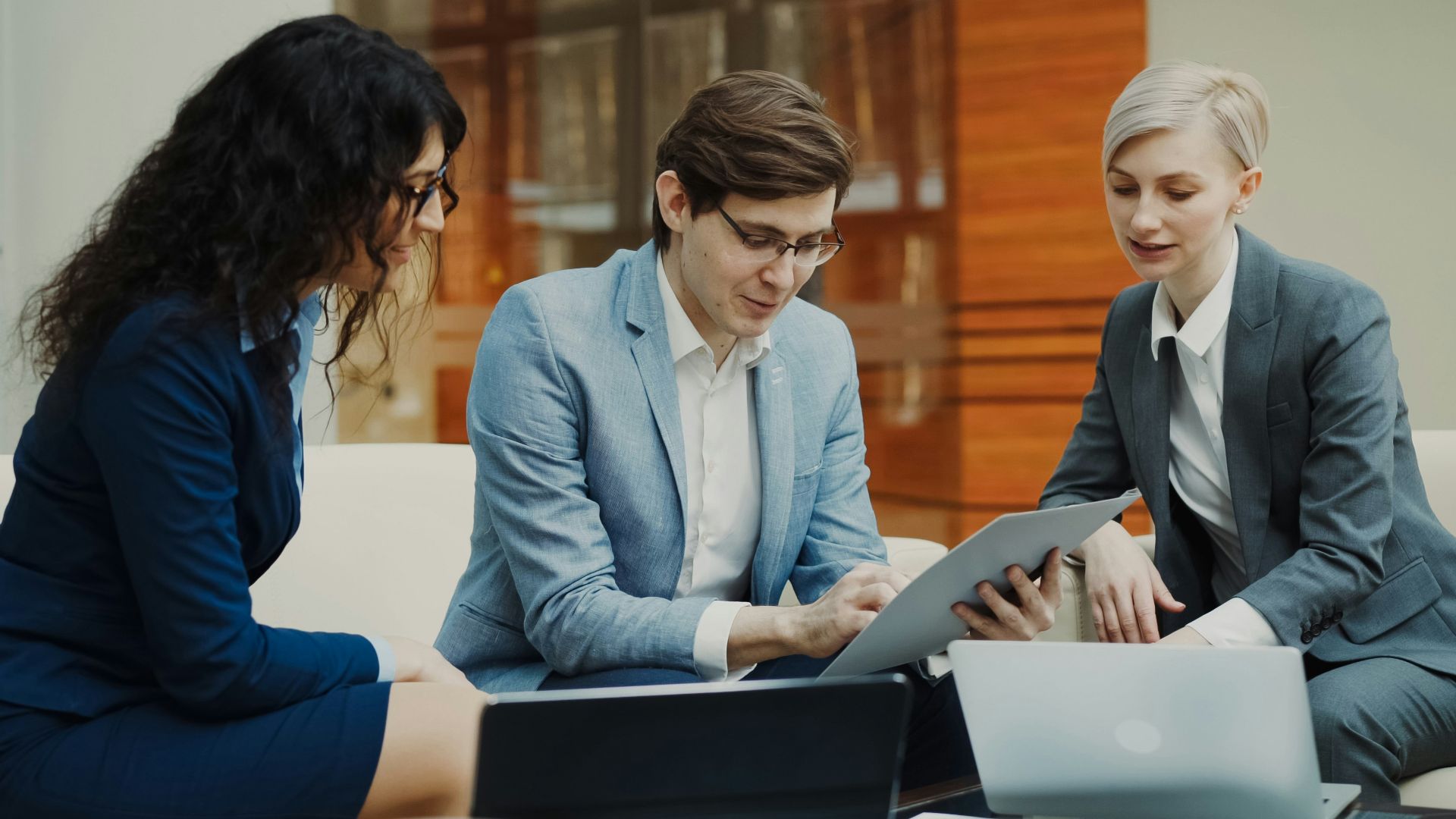 Three business people collaborating on a project