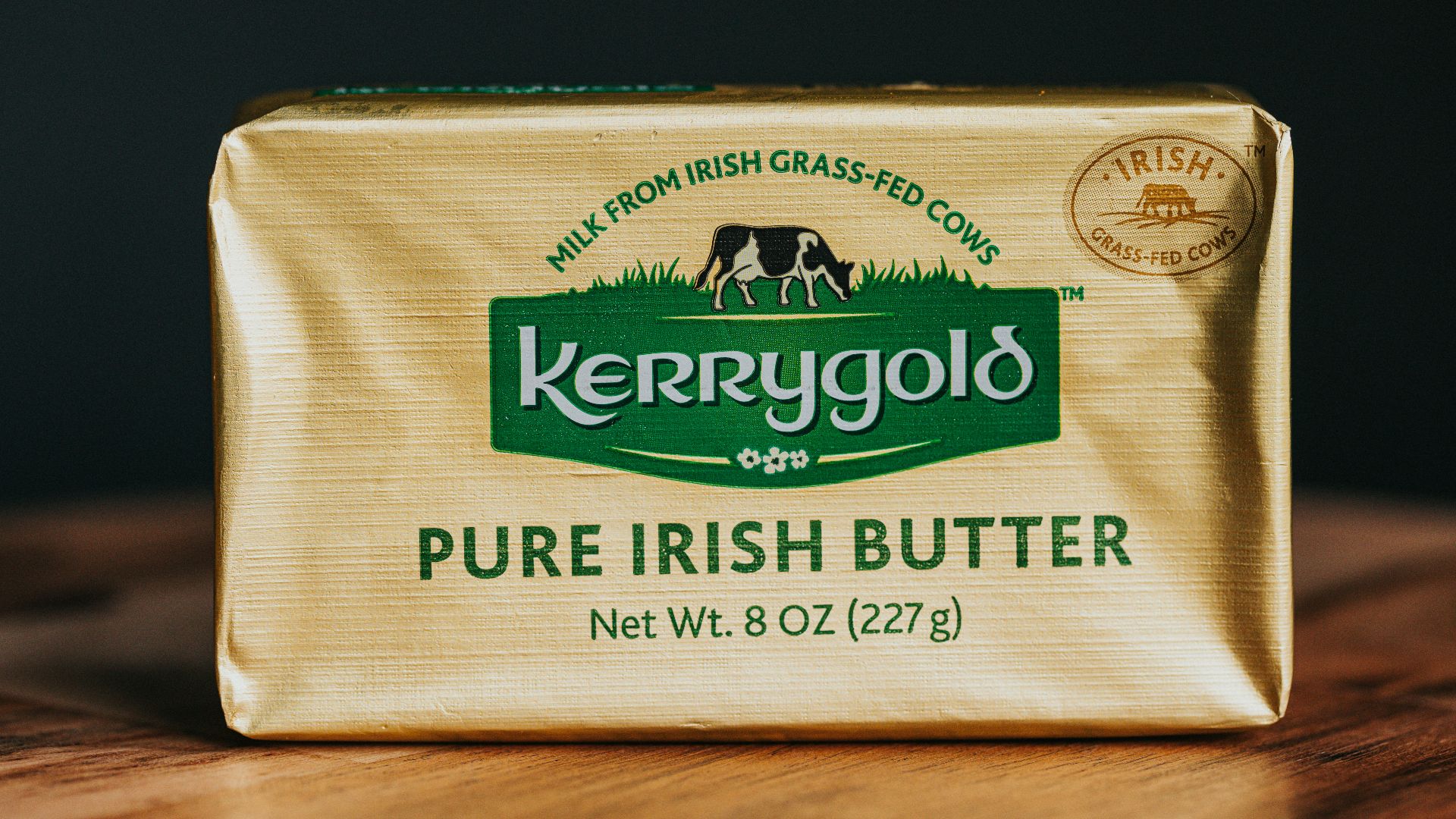 a bar of butter sitting on top of a wooden table