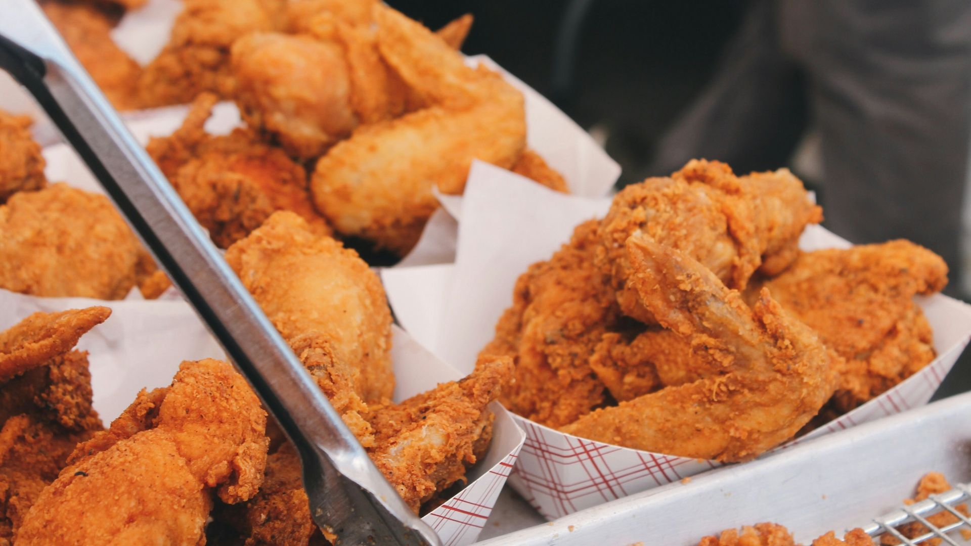 fried chicken on brown paper bag