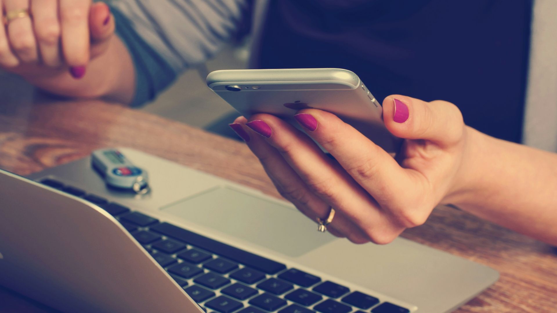 woman holding silver iPhone 6