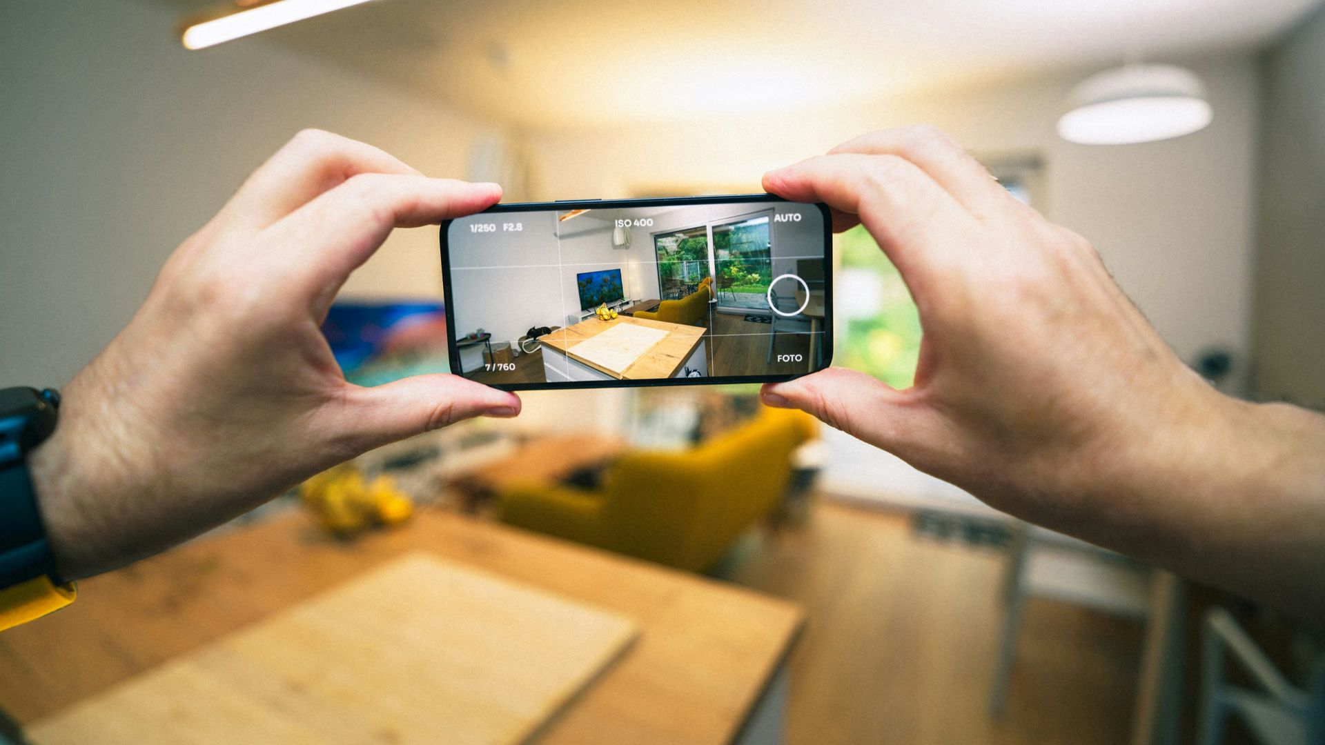 A person taking a picture with a cell phone