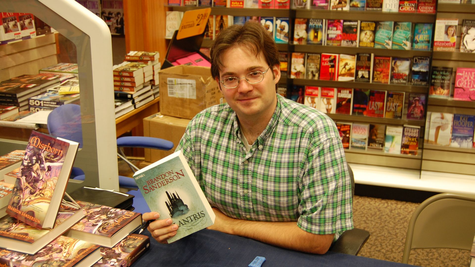 Brandon Sanderson holding a German-language copy of his fantasy novel Elantris on August 18, 2007 at the book pre-release event for Mistborn: The Well of Ascension at the Waldenbooks store in the Provo Towne Centre mall in Provo, Utah.