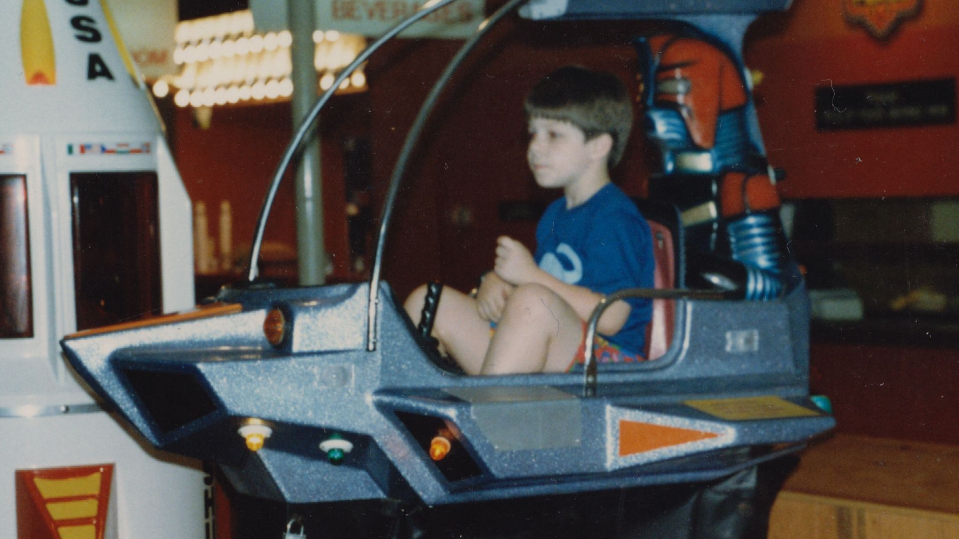 A child rides a ride at the Showbiz Pizza location in Fayetteville, Arkansas in May 1987.  The child is Ben Schumin, i.e. User:SchuminWeb.