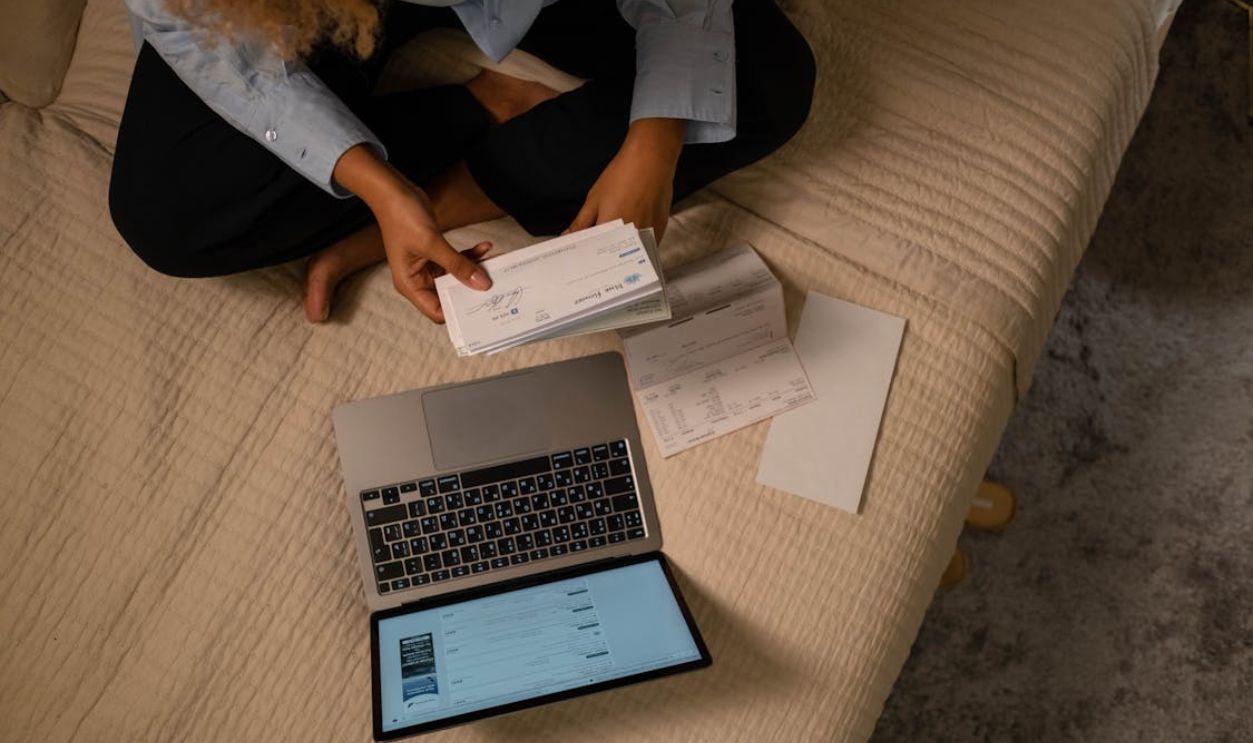 Overhead Shot of a Woman Holding a Cheque