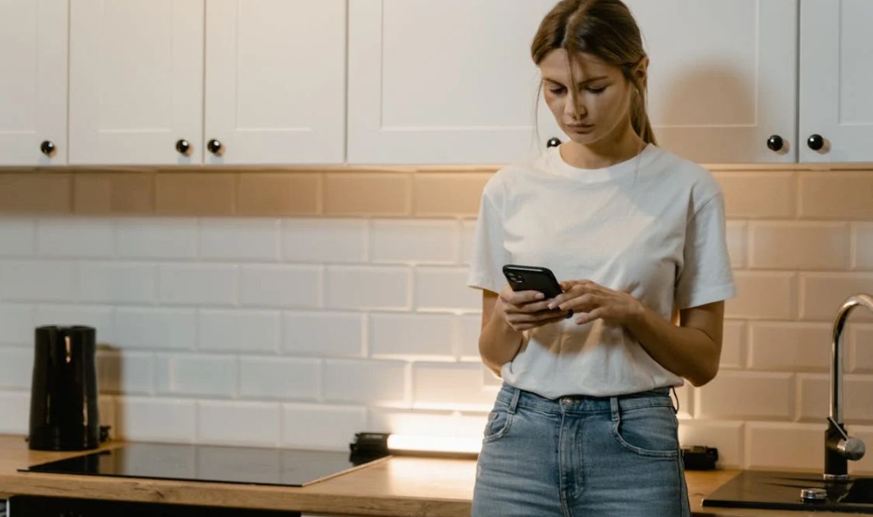 Close-Up Shot of a Woman Using a Mobile Phone