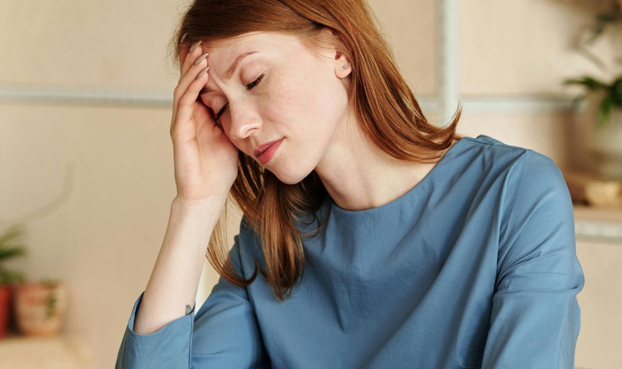 Exhausted Woman Working with Laptop