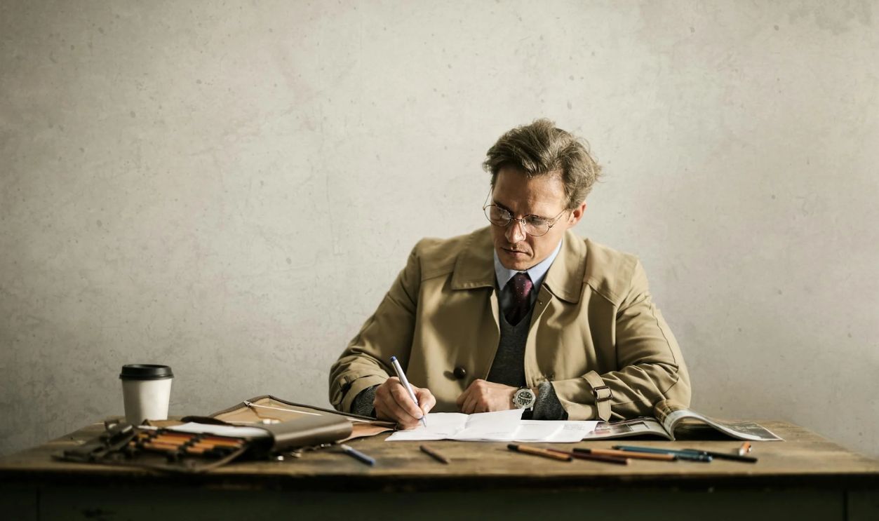 Focused male architect working on paper draft