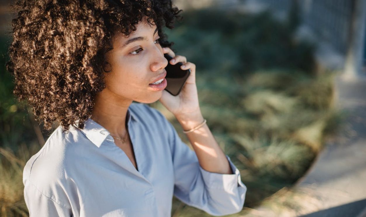 Attractive black woman talking on mobile phone