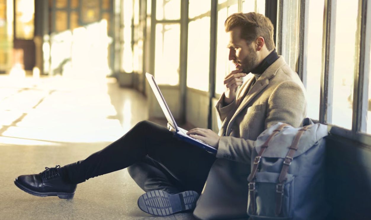 Brown Haired Man Using Laptop Computer