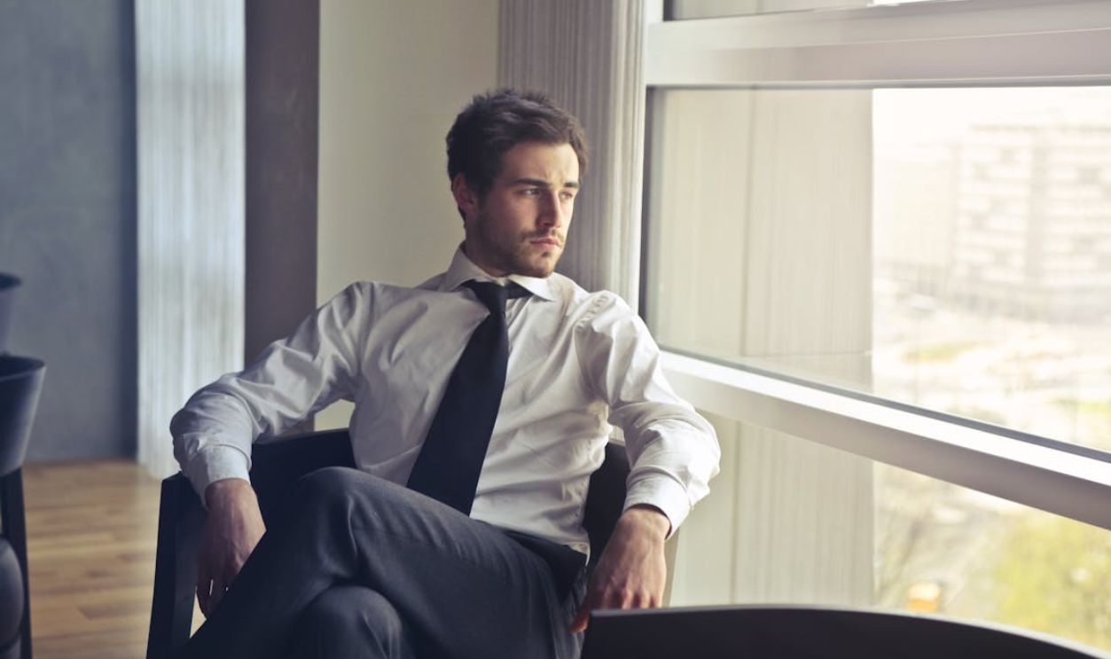 Man Wearing White Dress Shirt and Black Necktie