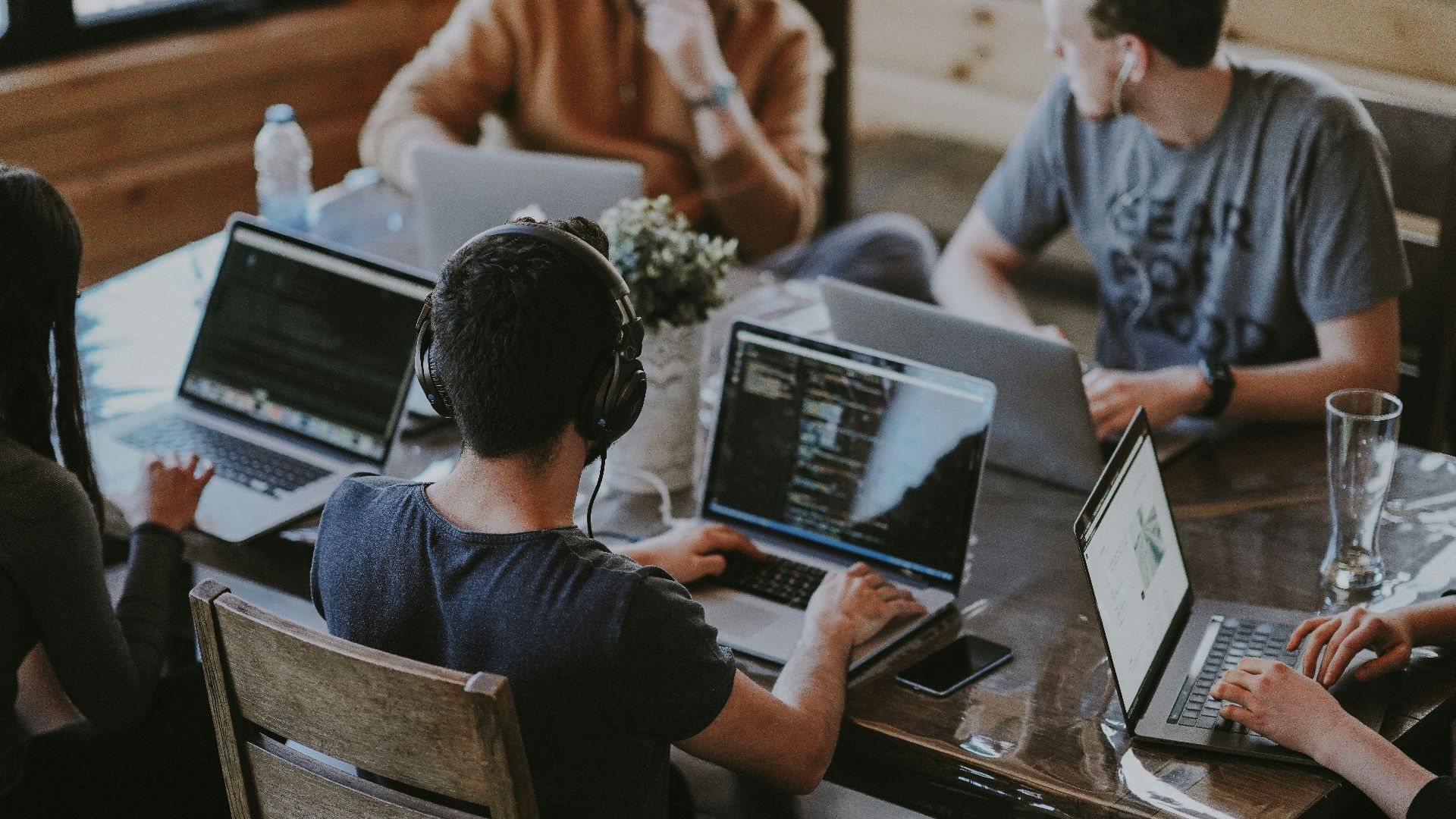group of people using laptop computer