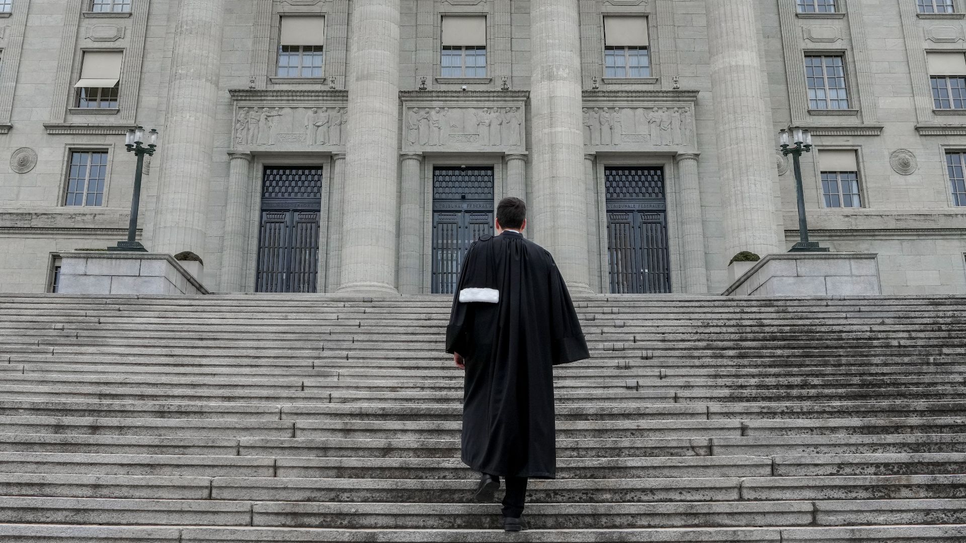 File:1002 Swiss lawyer in front of the Federal Supreme Court of Switzerland Photo by Giles Laurent.jpg