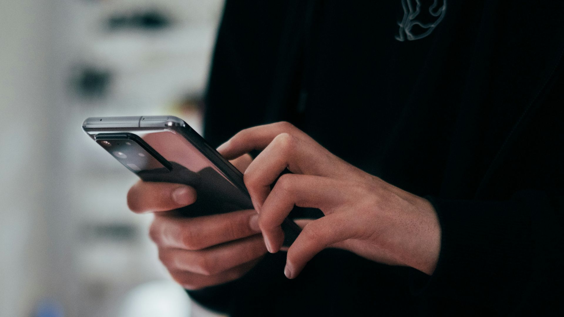 person holding black android smartphone