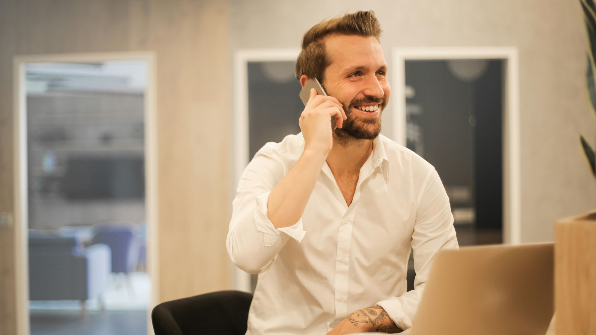 man using smartphone on chair