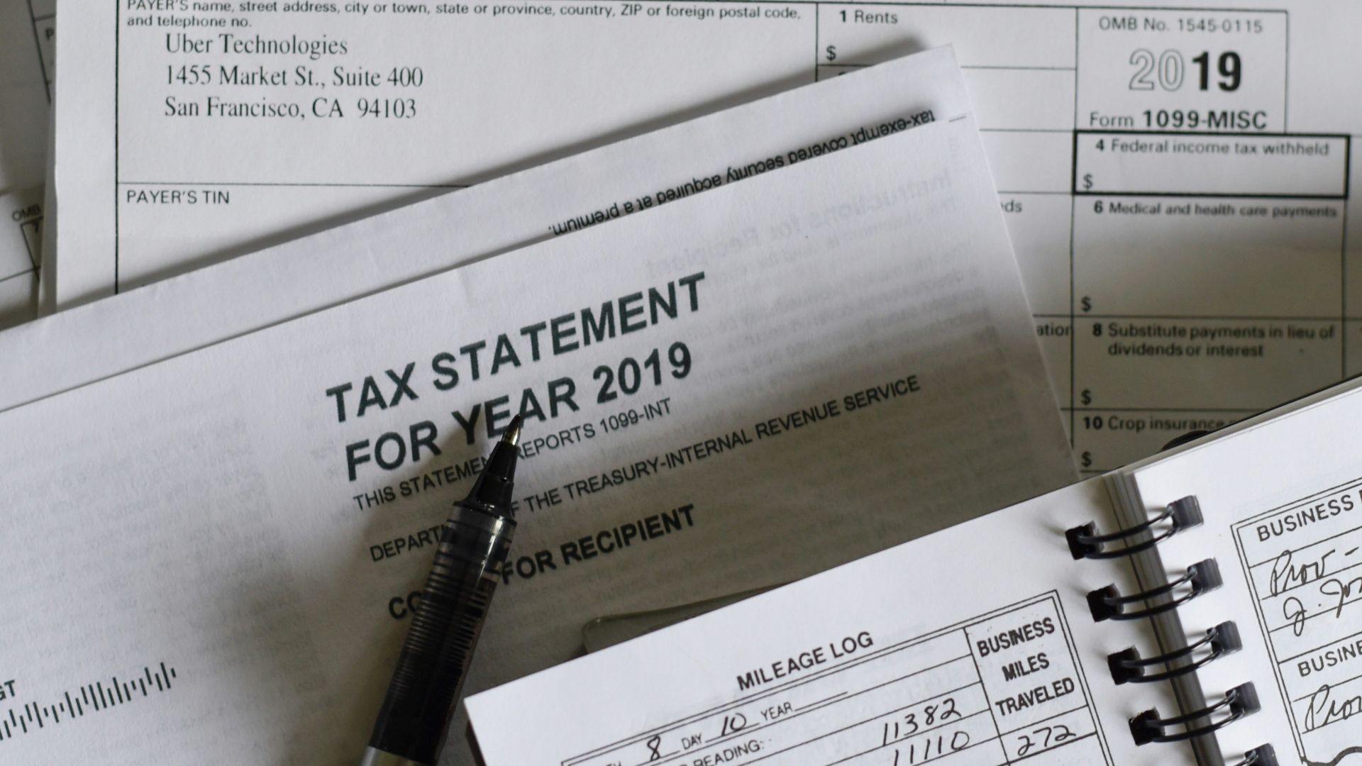 black and silver pen on white paper