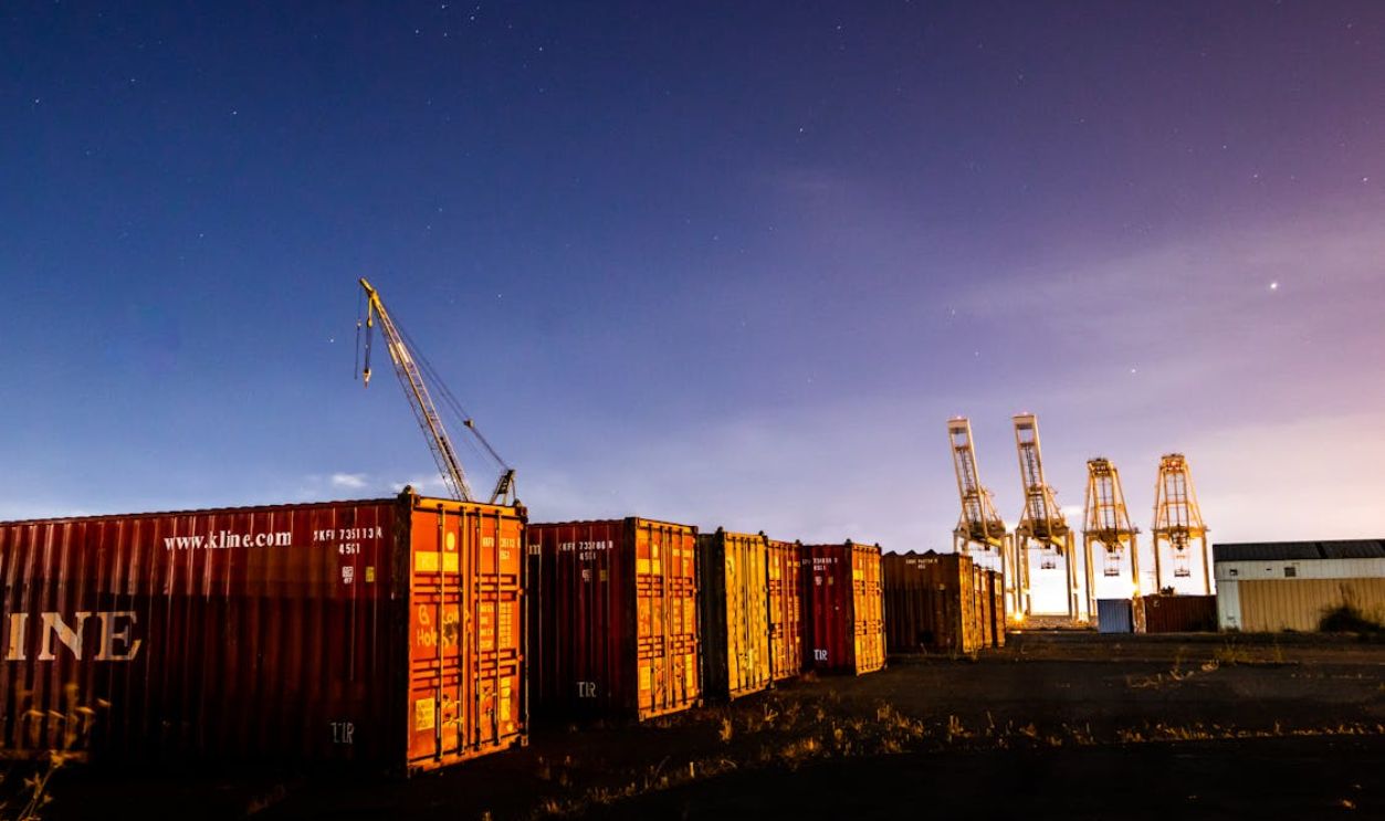Cargo Containers and Cranes on the Field
