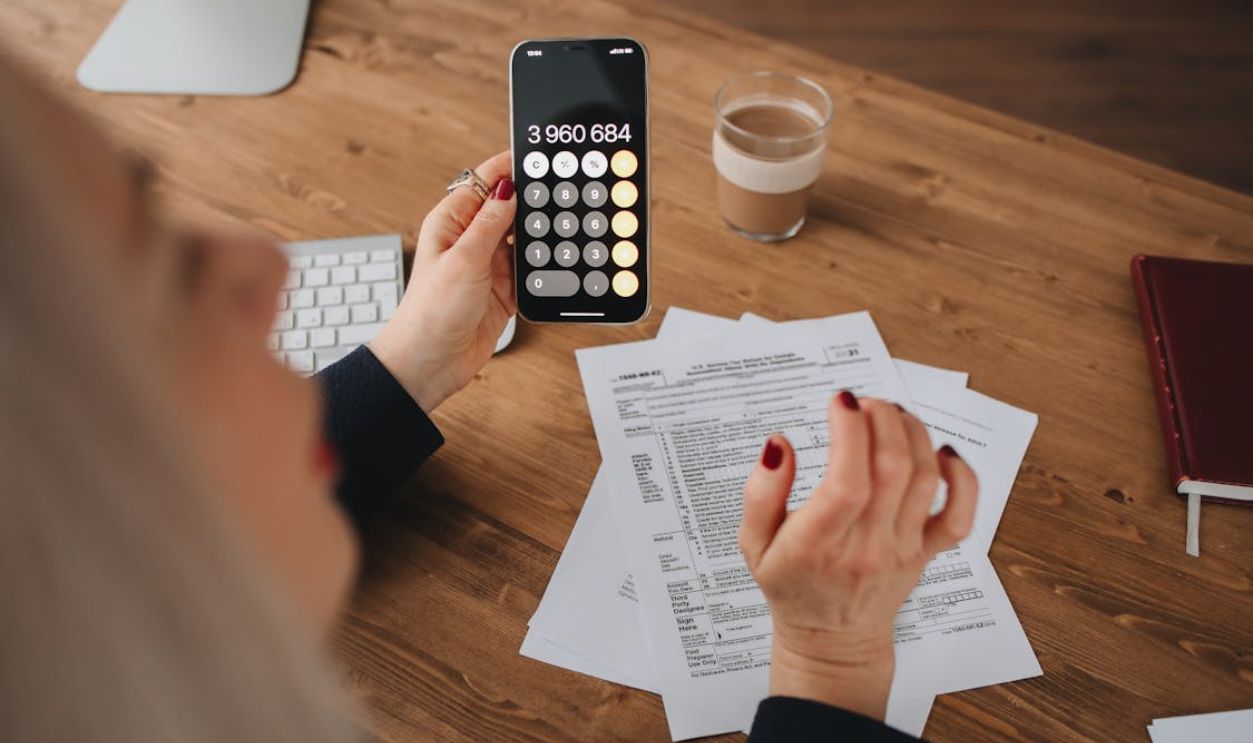 Person Holding using a Calculator
