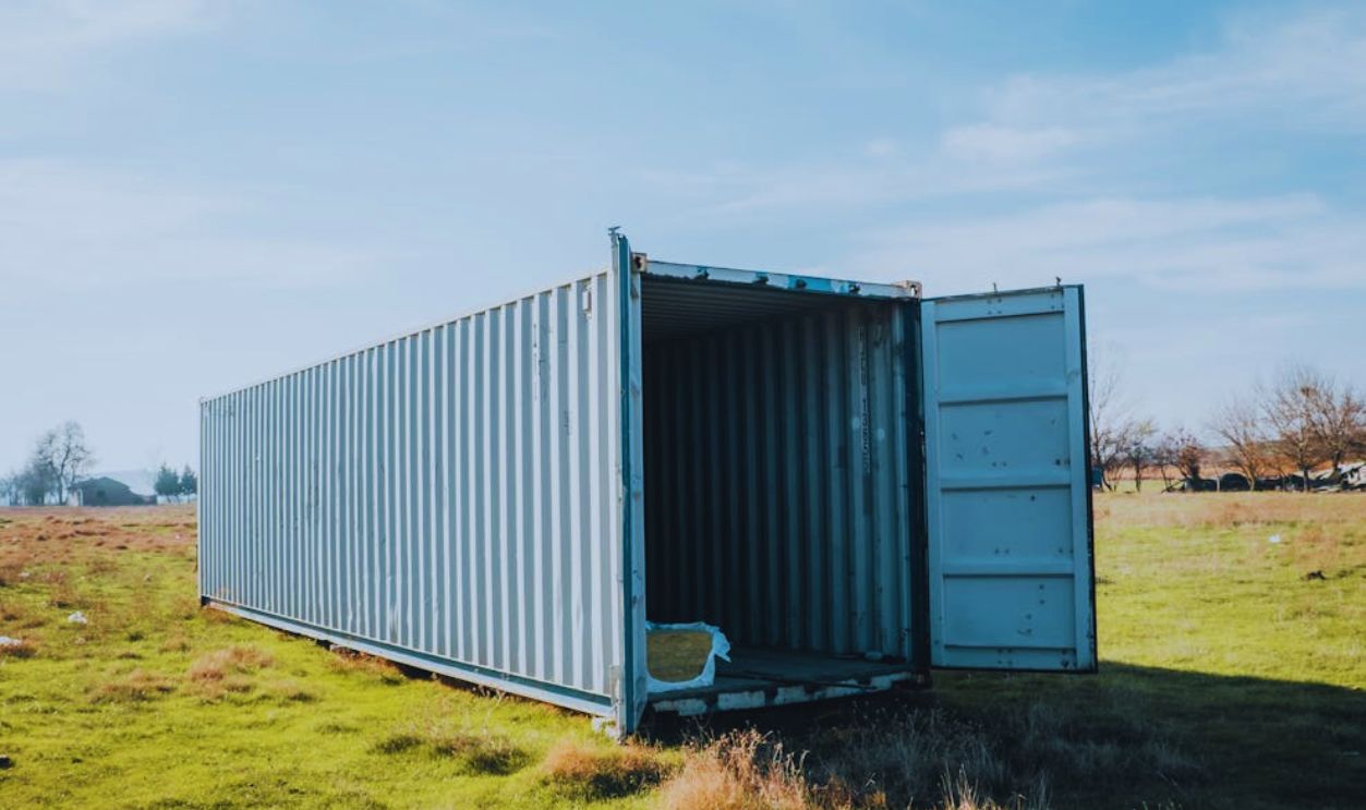 Metal Cargo Container on a Grass Field