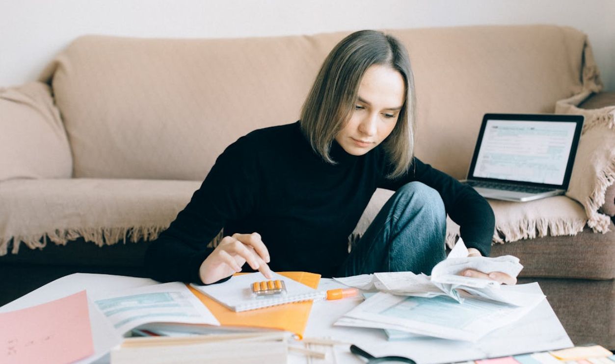 Woman in Black Long Sleeves Shirt Doing Accounting