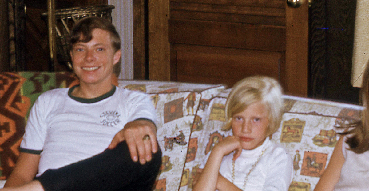 Family of children in the 1960s sitting on a couch