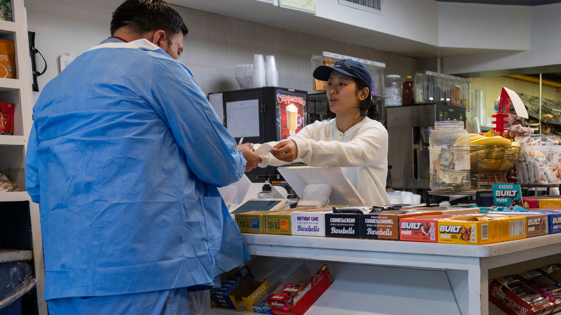 File:Cashier handing receipt.jpg