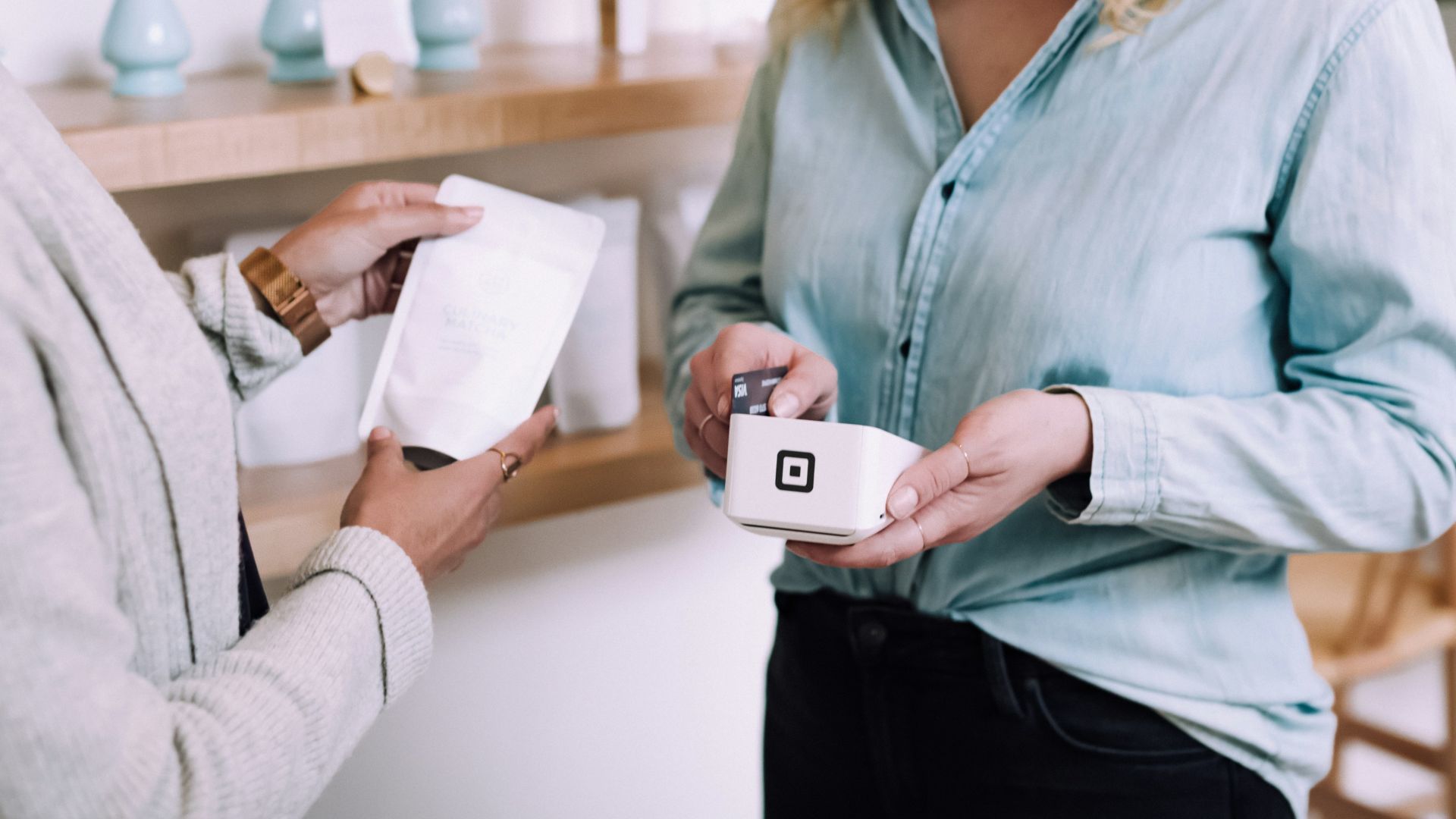 woman holding white pack