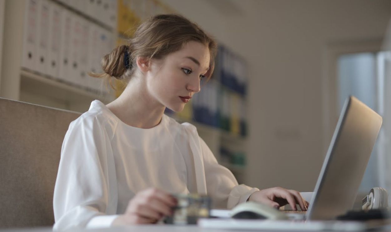 Focused Woman looking at Laptop