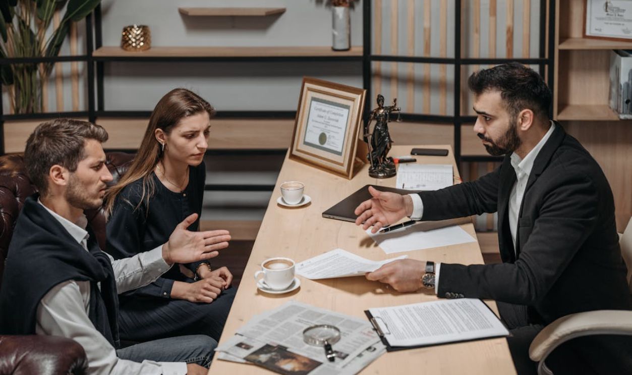 Male Lawyer talking to his Clients