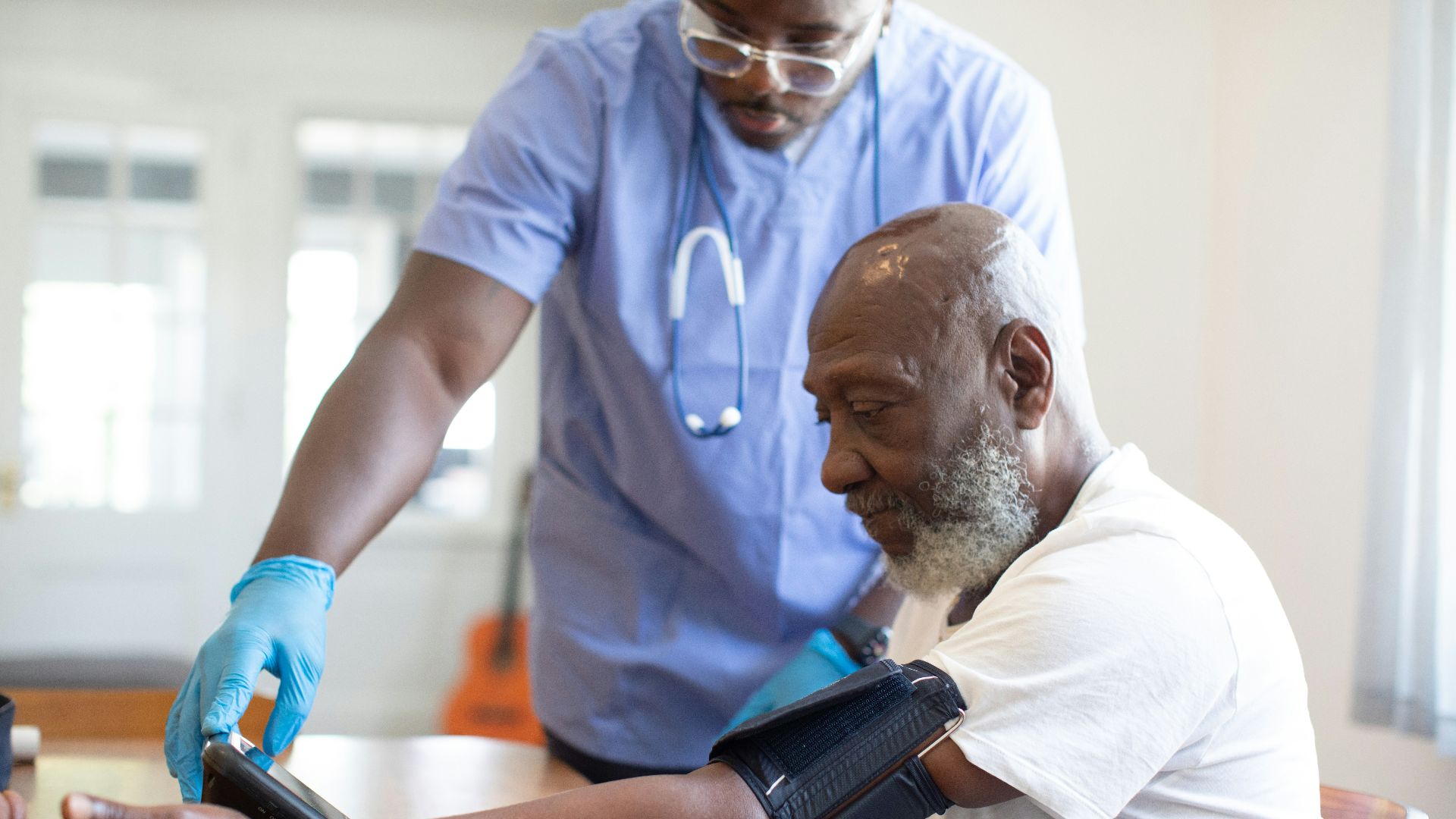 a doctor checking a patient's blood pressure