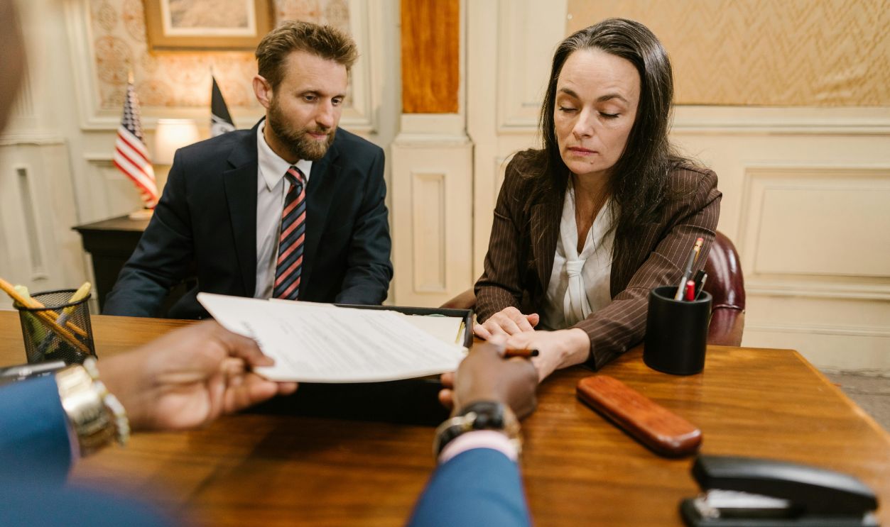 Man and Woman Sitting at the Table