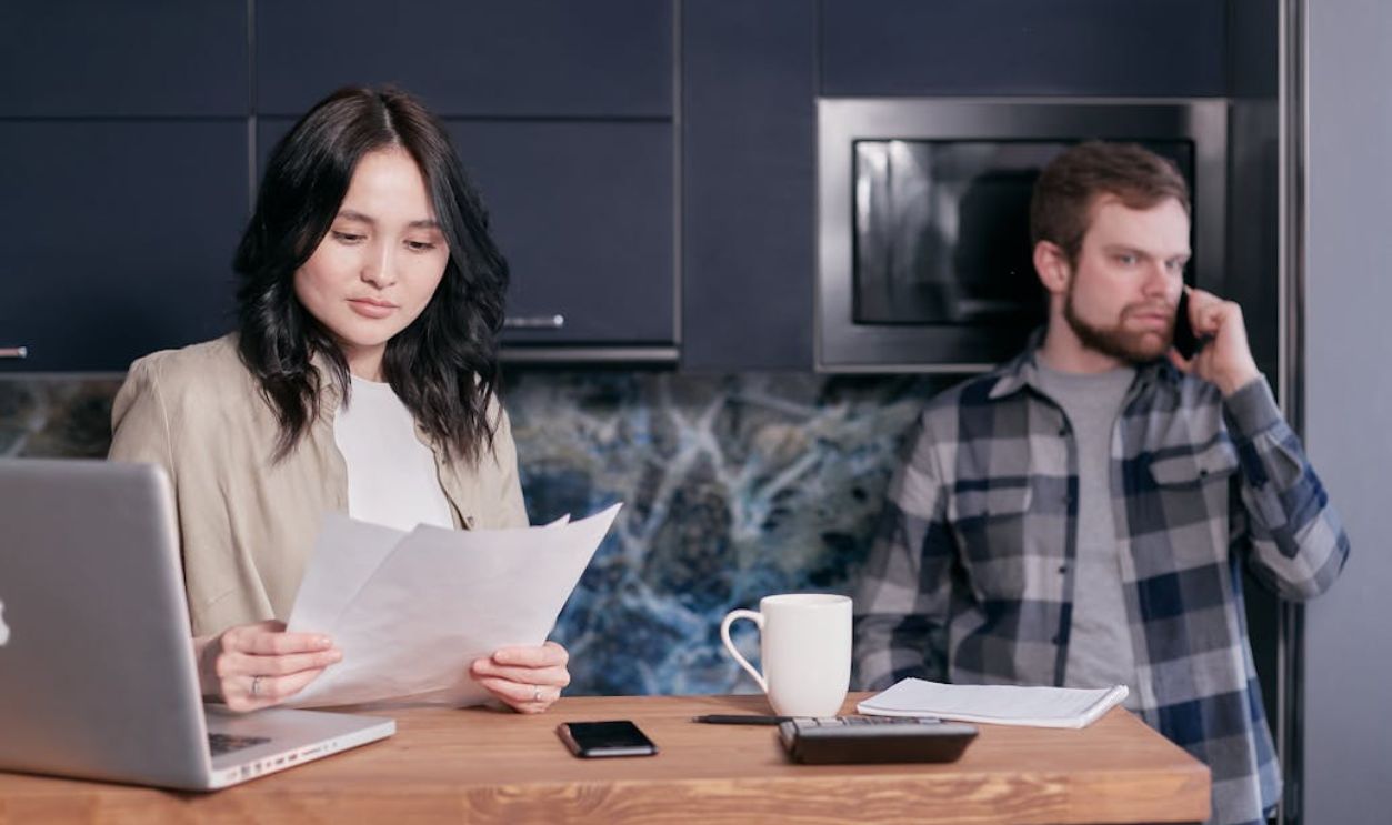 A Woman Looking at the Documents