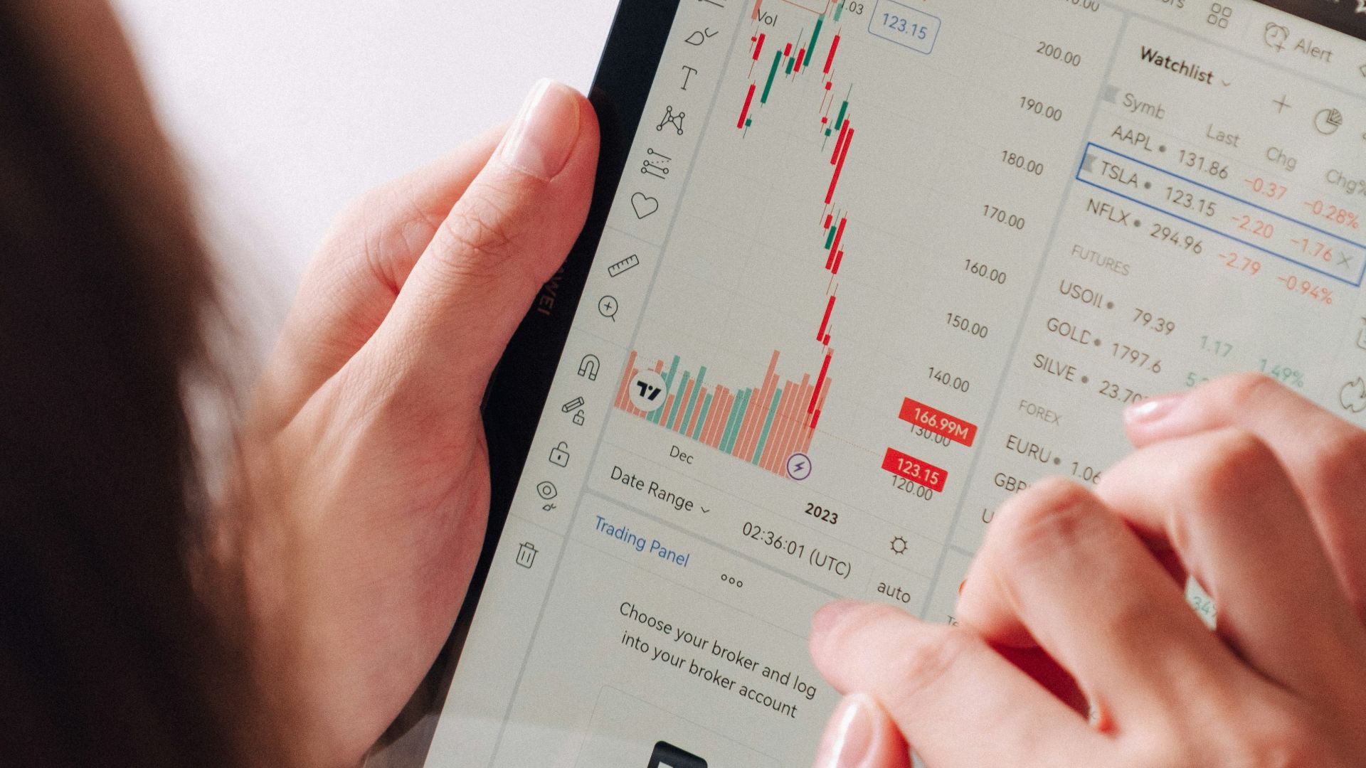 a woman holding a tablet with a chart on it