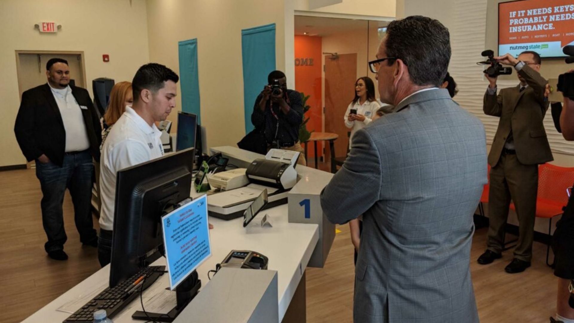 Wednesday, June 6, 2018 -- Governor Dannel P. Malloy today announced that beginning this Thursday, June 7, 2018, a new, state-of-the-art DMV Express Center will open at the Nutmeg State Financial Credit Union at 977 Boston Post Road in Milford.  The location will offer customers the ability to renew driver’s licenses and ID cards while utilizing services designed to help streamline the transactions, including the ability to offer appointments, provide service tickets stamped with same-day times, offer self-service information kiosks, and provide text and email messages for customer convenience.