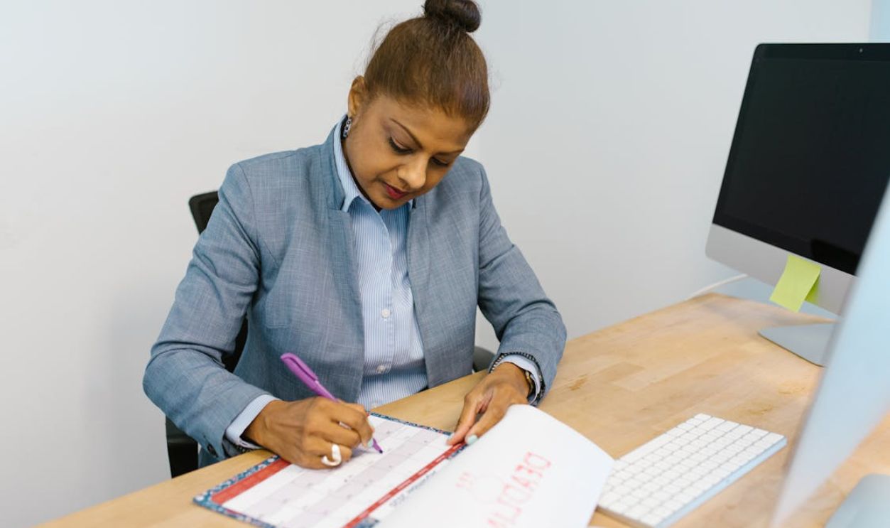 Woman Marking Her Calendar