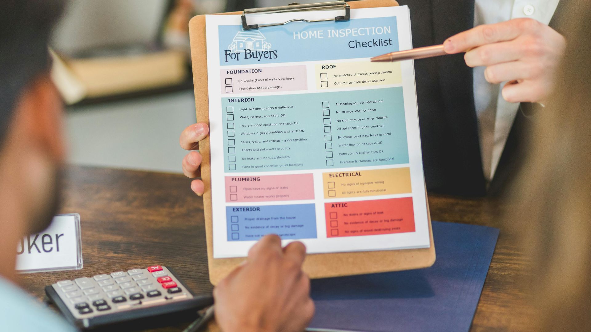 Realtor explaining home inspection details to clients at office with checklist and calculator.