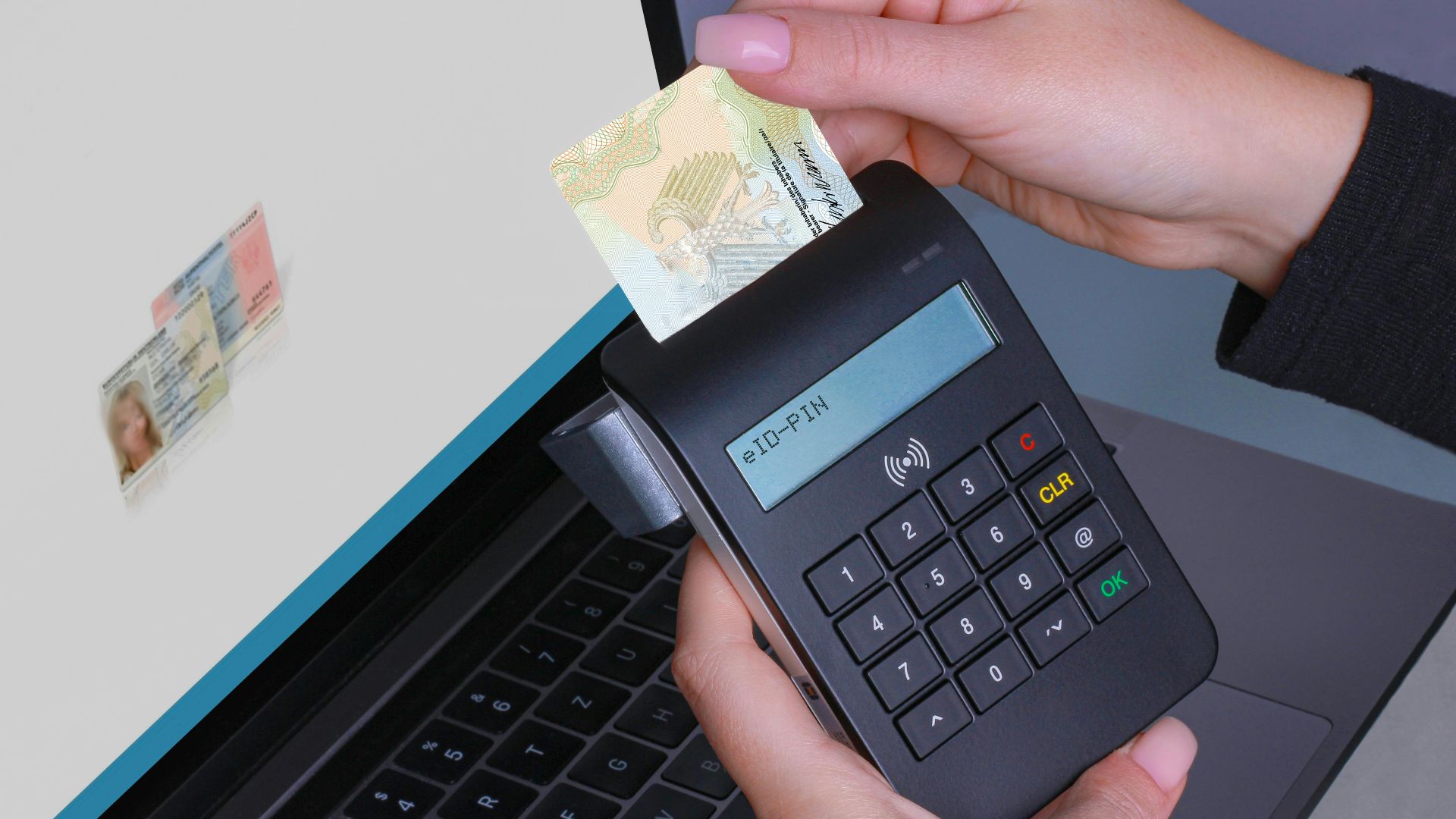 Person using contactless device for ID payment verification on a laptop.