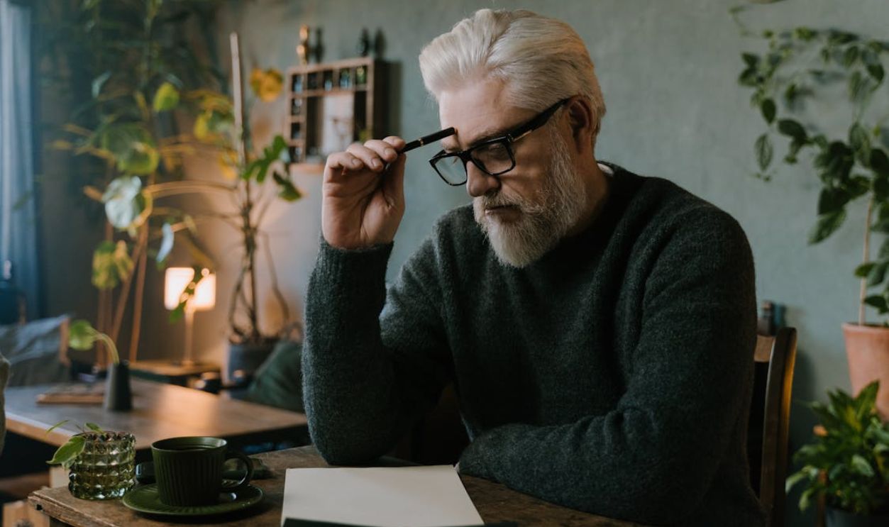 A Man Sitting at the Table