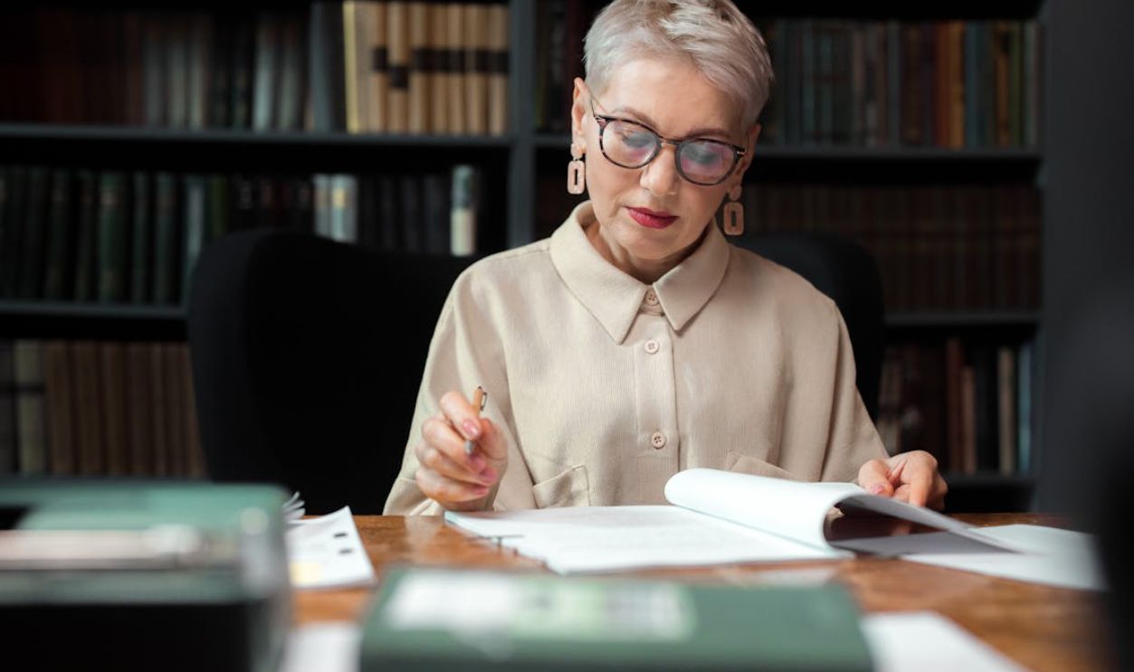 Woman in Beige Top Reading