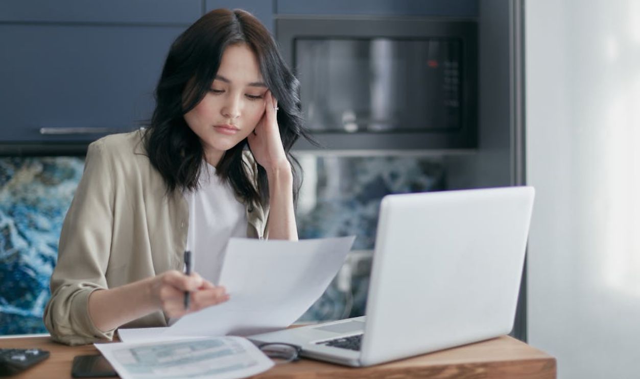 Woman Looking at Documents