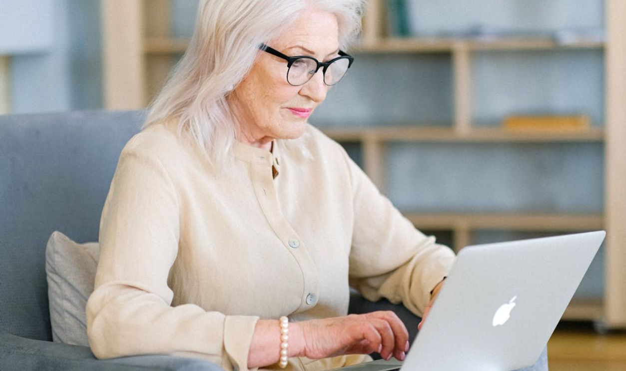 An Elderly Woman using a Laptop