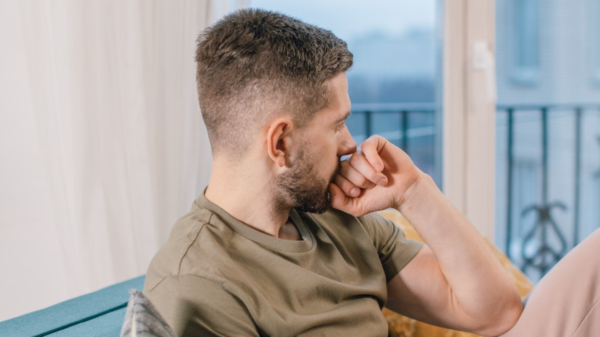 Man thinking and looking at side.