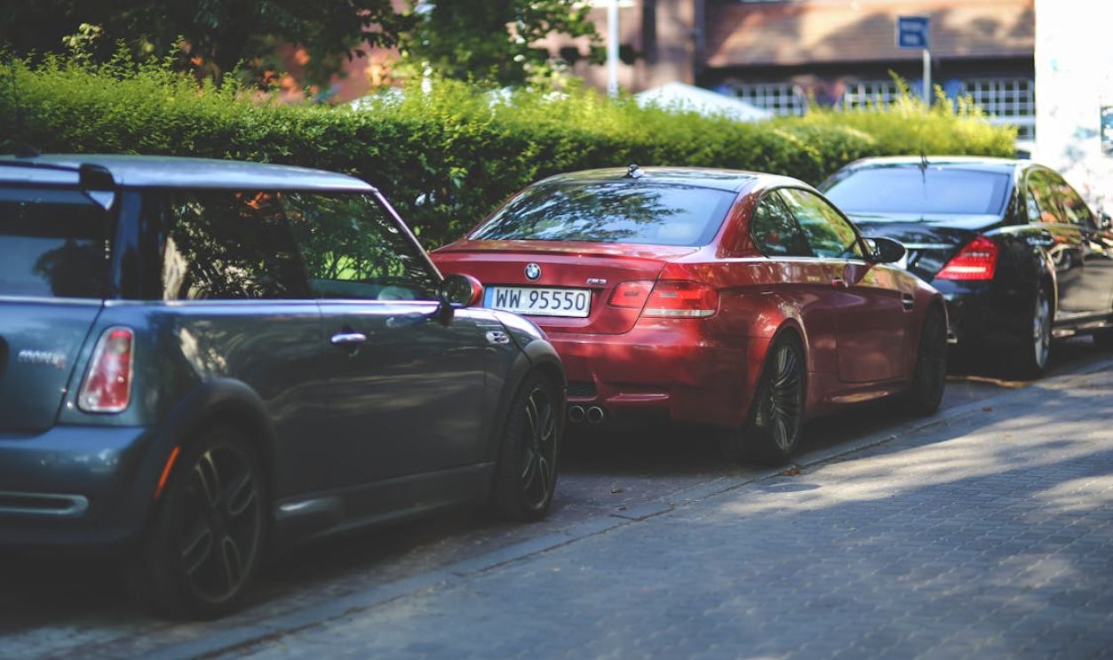 Cars parked along way