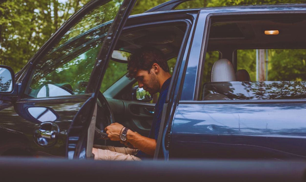 Man Sitting Inside Vehicle