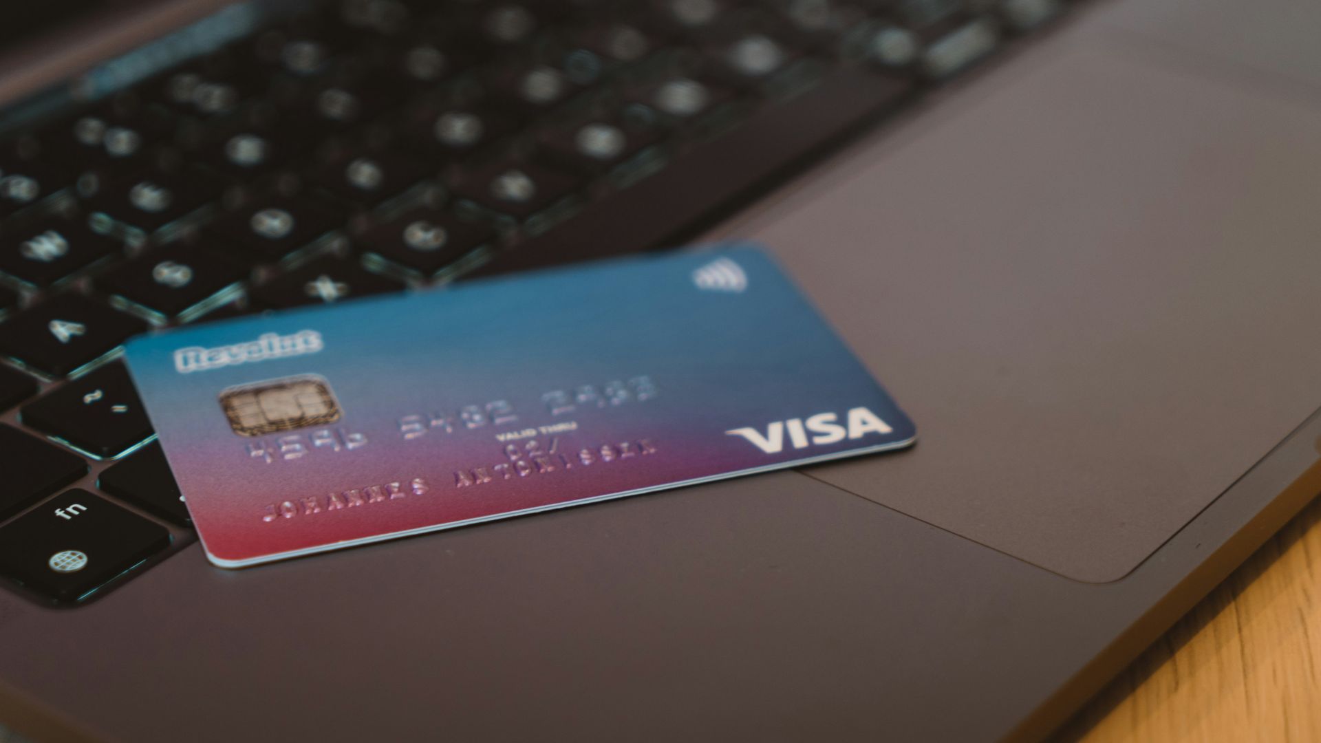 blue and white visa card on silver laptop computer