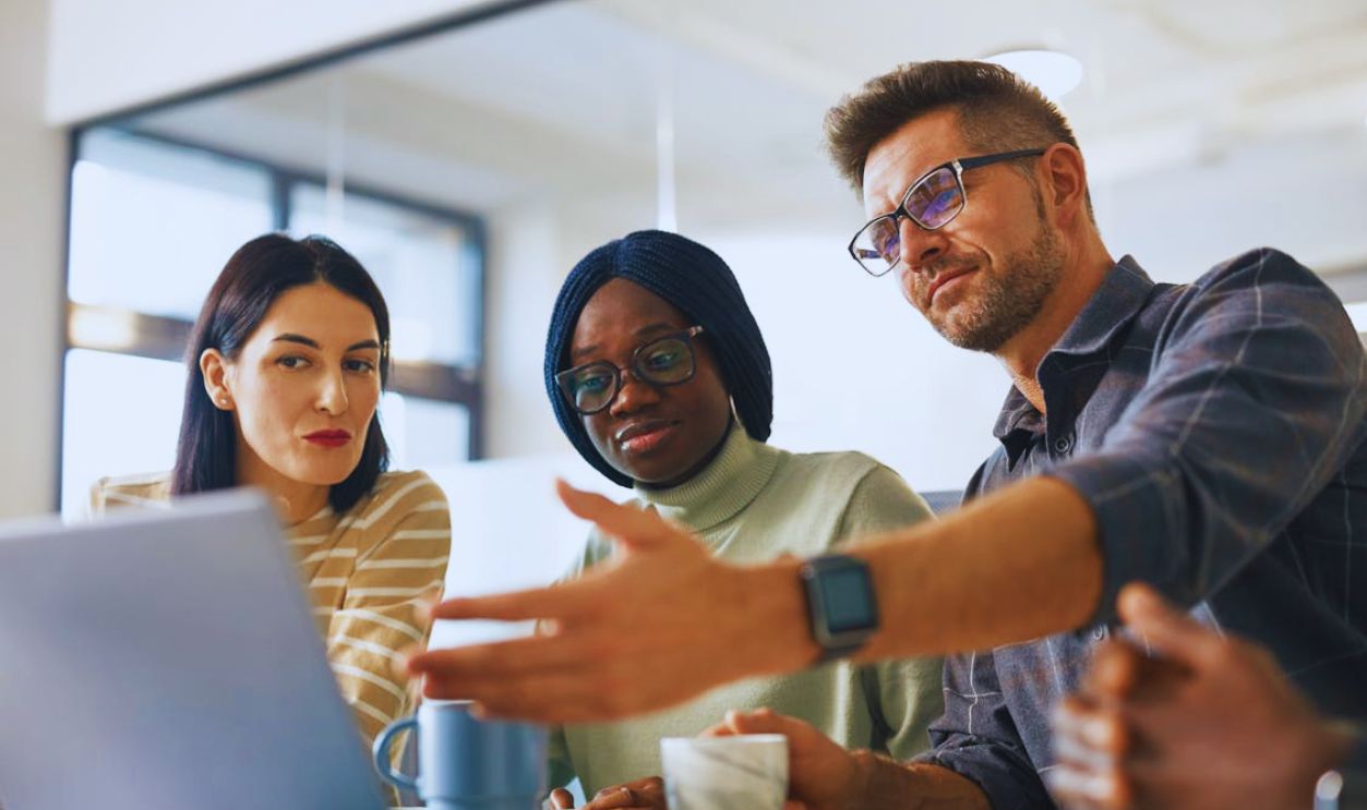 A Group of People Having a Meeting in the Office