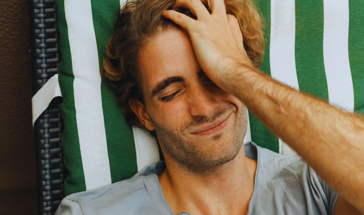 A Man Holding His Head